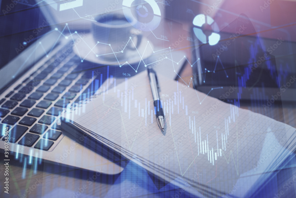 Double exposure of forex chart drawing and desktop with coffee and items on table background. Concept of financial market trading Double exposure of forex chart drawing and desktop with coffee and items on table background. Concept of financial market trading
