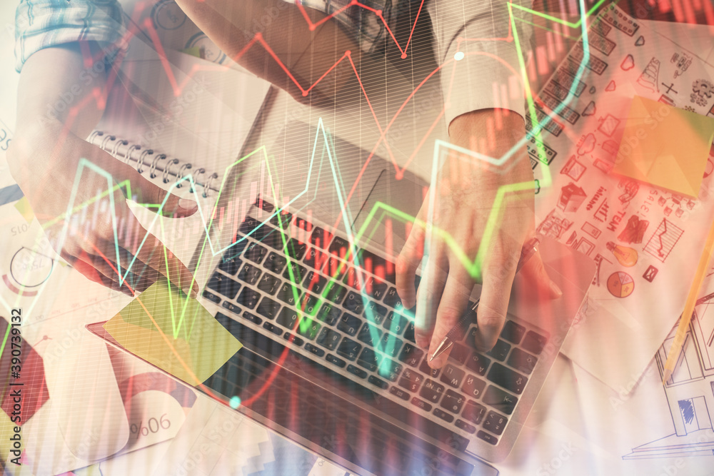 Double exposure of man and woman working together and forex graph hologram drawing. Financial analysis concept. Computer background. Top View. Double exposure of man and woman working together and forex graph hologram drawing. Financial analysis concept. Computer background. Top View.