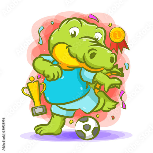 The crocodile kick the ball for the champion with the trophy near him