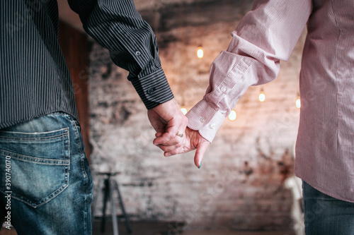 Couple in love hold each other's hands