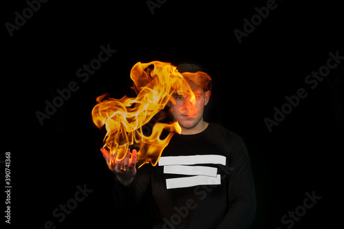 Картината върху платно Guy holding big flame in his hand.