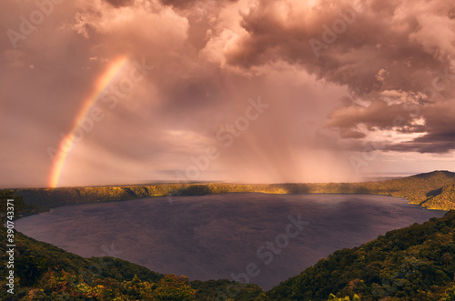 A dramatic sky and rainbow during sunset on Laguna de Apoyo from Mirador de Catarina, Nicaragua