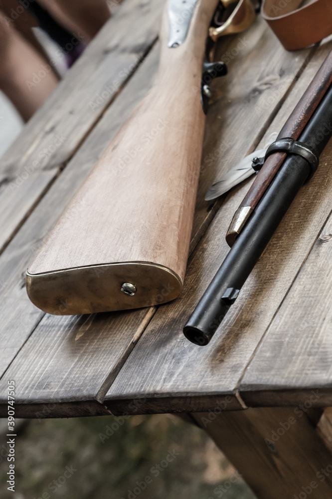 musket butt and barrel part of a firearm close-up background military musket butt and barrel part of a firearm close-up background military