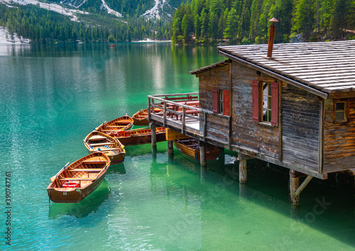 close up of  boatshouse in the clear calm water of iconic mountain lake Pragser Wildsee (Lago di Braies) in Dolomites, Unesco World Heritage, South Tyrol, Italy photo