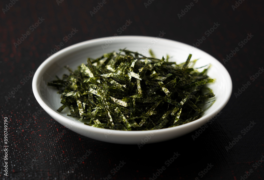 Chopped seaweed on a black background Chopped seaweed on a black background