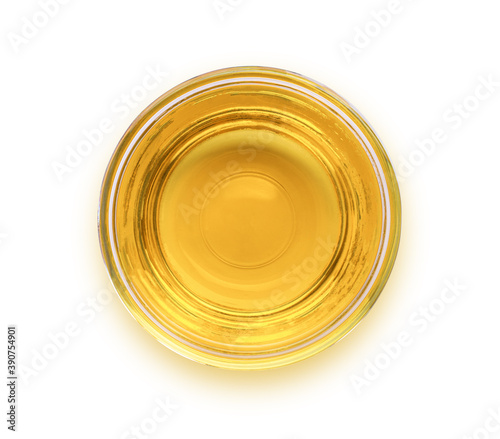 Olive oil or cooking oil in glass bowl isolated on white background with clipping path. Top view. Flat lay.