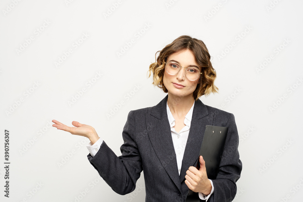 Woman in business suit finances work documents glasses hairstyle Woman in business suit finances work documents glasses hairstyle