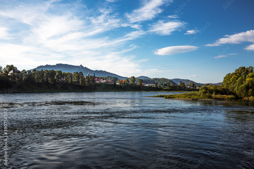 View of the village of Turochak on the Bank of the Biya. altai republic View of the village of Turochak on the Bank of the Biya. altai republic