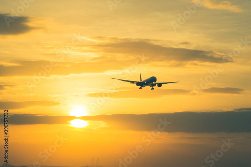 aircraft landing with sun set background
