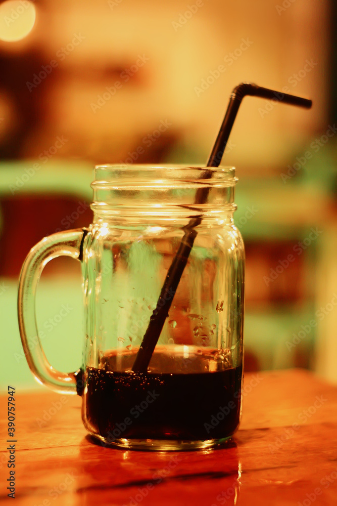 close up of glass of soda cola with straw close up of glass of soda cola with straw