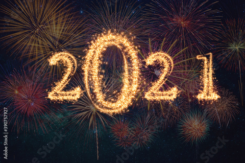 2021 written with Sparkle firework on dark background, Happy new year and merry christmas celebration, banner and greeting cards concept