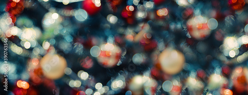 merry christmas and happy new year word on abstract bokeh of  ball and string lights on xmas tree.holiday celebration greeting card