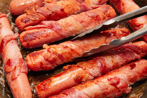 Bacon Wrapped Sausages Ready for Delicious Hot Dogs