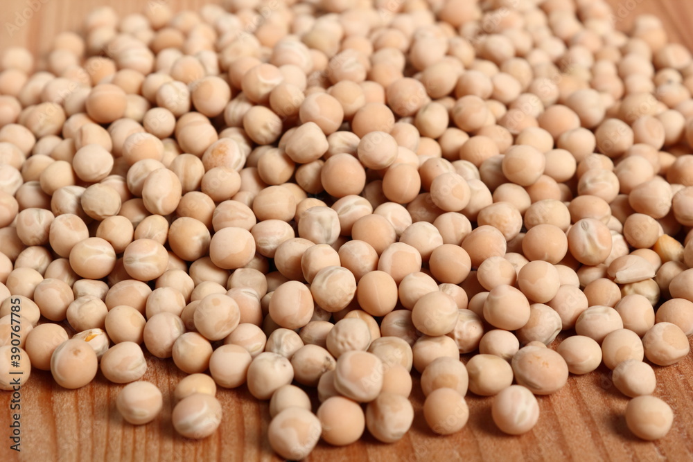 Whole yellow peas at wooden plank background Whole yellow peas at wooden plank background