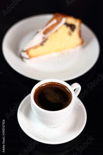 Coffee cup and cake with sugar icing