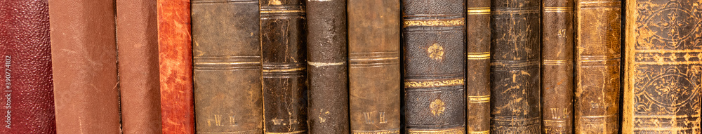 Row of old 100 years old books on a shelf. Stock Photo | Adobe Stock