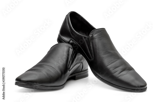 Pair of black classic leather shoes on white.