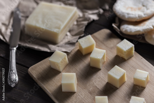 Halloumi cheese cut into square pieces. Country style.