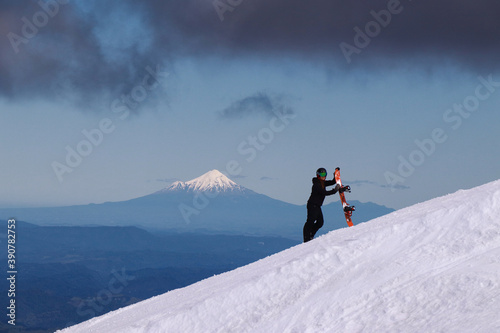 View on Mount Taranaki from Turoa Skifield, snowboarder in background, winter season, New Zealand