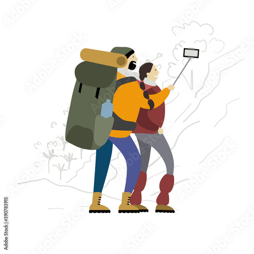 Couple of Hikers with backpacks takes selfie in mountains