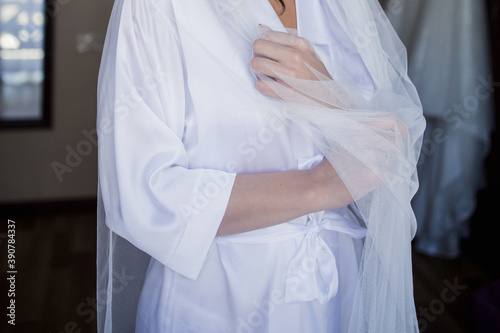 bride in the morning in a negligee at the wedding