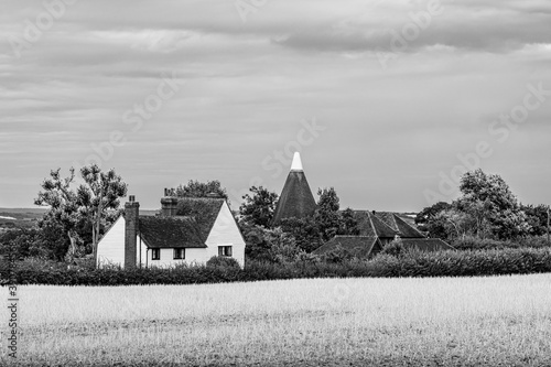 Landcape of a traditional English country house on the fields in Kent, England, Uk photo