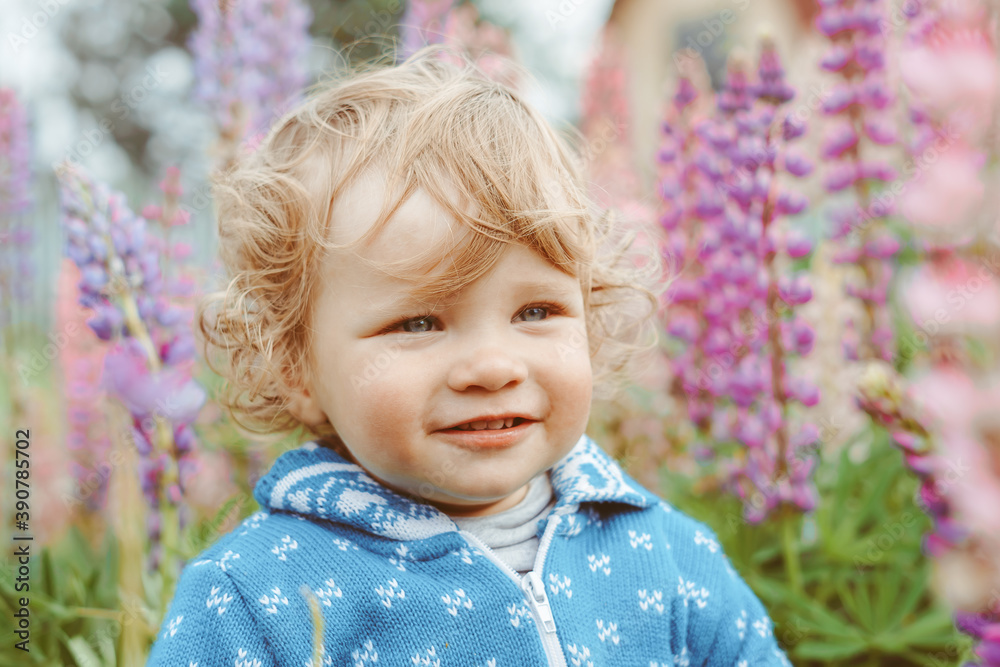 a child plays among the grass