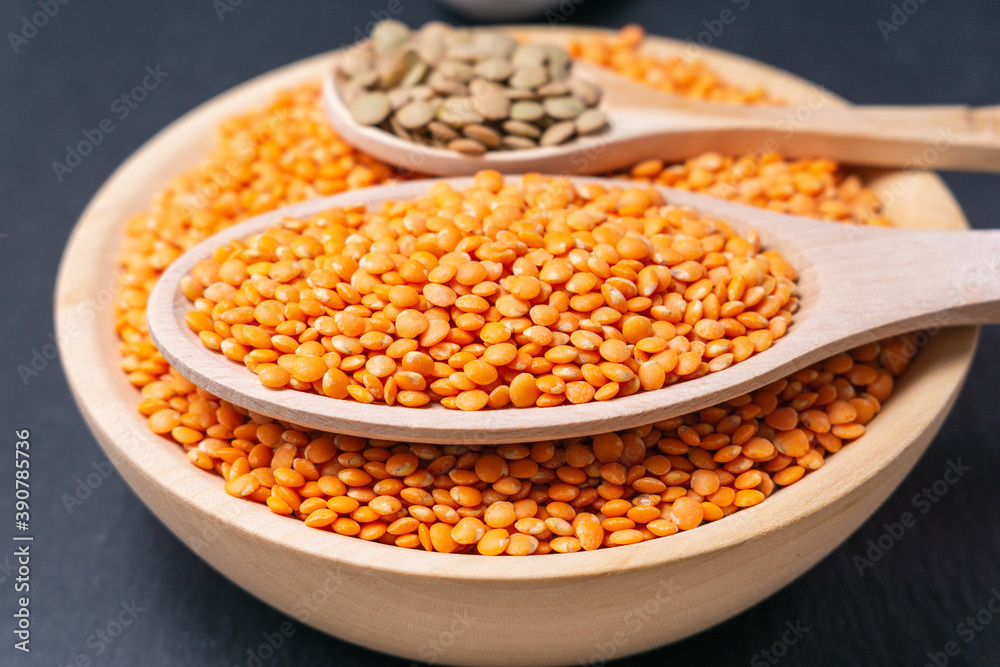 orange lentils in a wooden bowl. selective focus orange lentils in a wooden bowl. selective focus