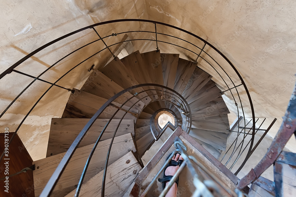 The spiral wooden stairs down