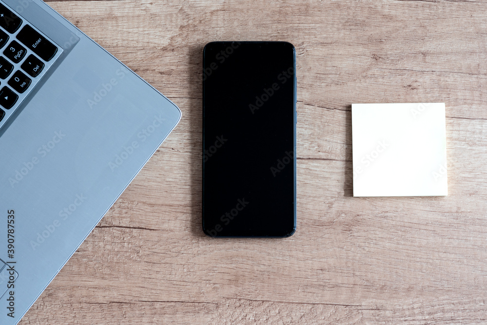 laptop, smartphone, notes. laptop, smartphone, notes.