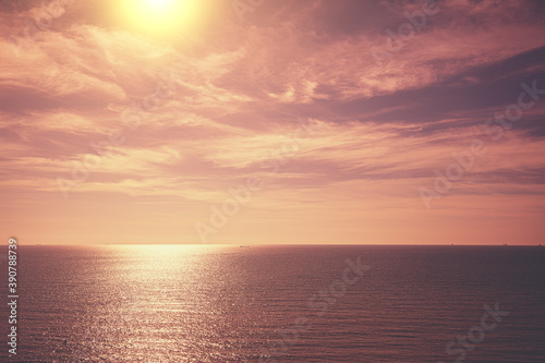 Seascape in the evening. Beautiful evening sky with cirrus clouds over the calm sea