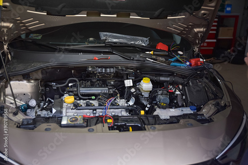 Legionowo, Poland - May 07, 2020: Car mechanic installing a gas