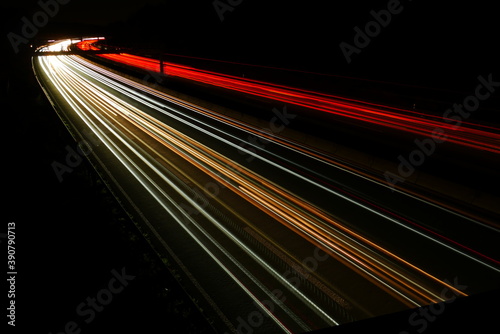 interstate highway at night with right curve and bridge