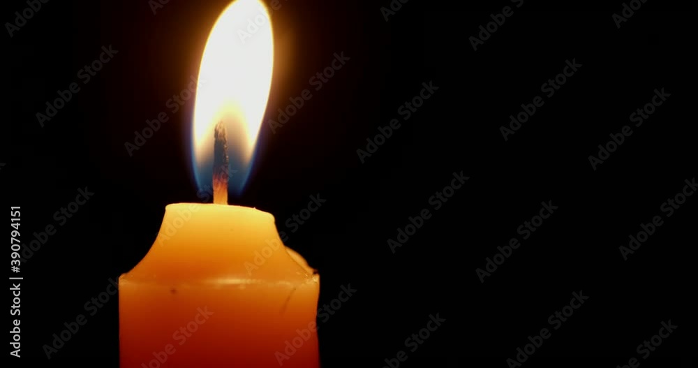 One candle burns with a bright flame. One candle burns with a bright flame.