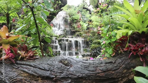 Natural waterfall in the forest is rich, beautiful and shady.