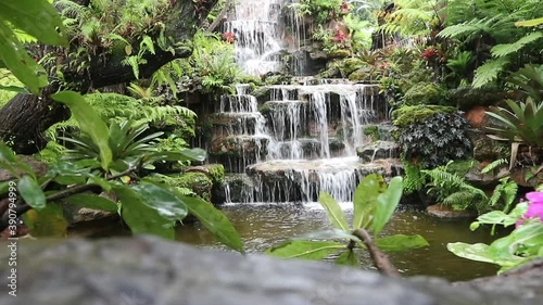 Natural waterfall in the forest is rich, beautiful and shady.