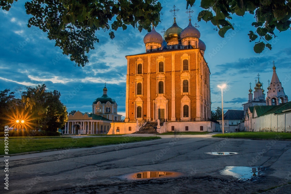 The lit up Assumption Cathedral in the evening in the yard of Ryazan Kremlin, Russia.
