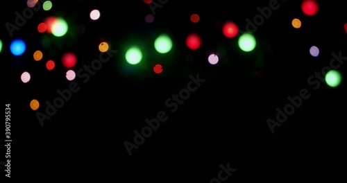 The Christmas lights of the garland sparkle brightly. 