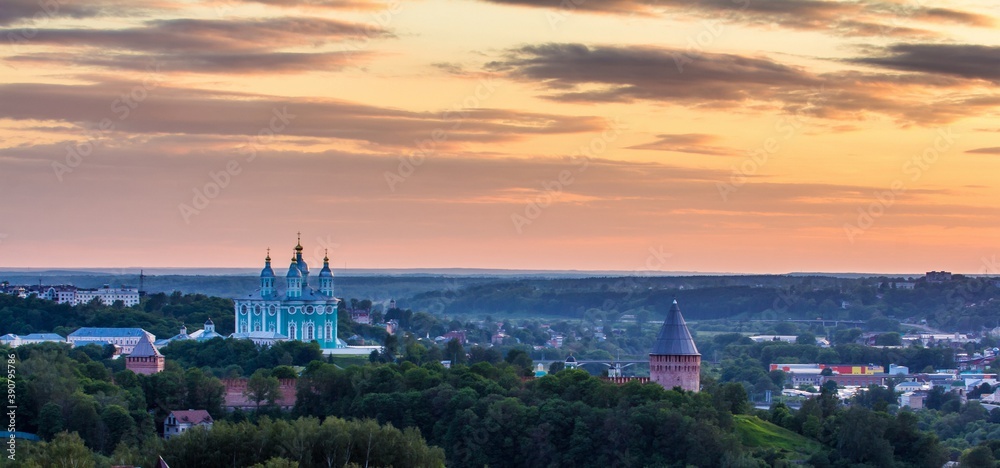 Panoramic view of Smolensk city at sunset: the Cathedral of Assumption over the buildings and the Kremlin in summer in Russia.