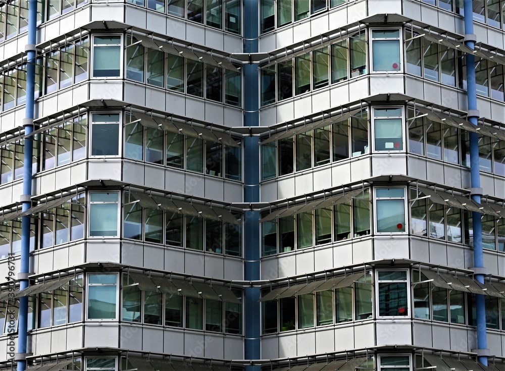 Perfect simmetry in a office building with beautiful glass windows 