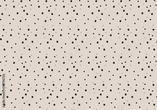 Vector of random grey and black dots on beige background