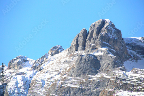 Dolomites mountain range at Lake Tovel in Italy photo