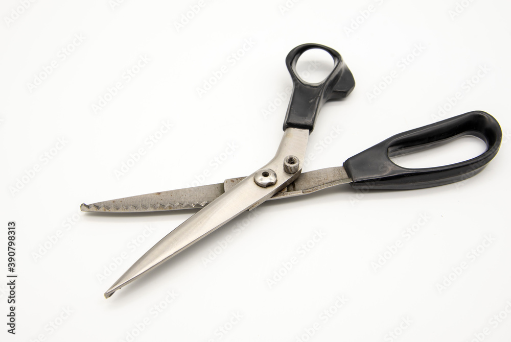 Old tailor scissors on a white background. Old tailor scissors on a white background.