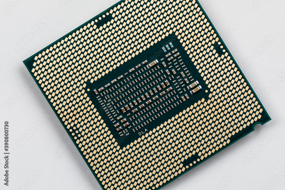 CPU : Central Processing Unit, Computer processor from the bottom side, socket contact isolated on white background CPU : Central Processing Unit, Computer processor from the bottom side, socket contact isolated on white background