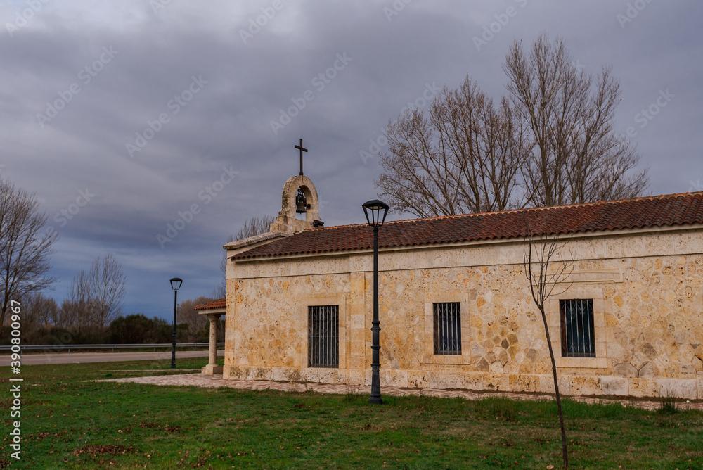 spanish romanesque hermitage in a stormy day with cloudy and dramatic sky
