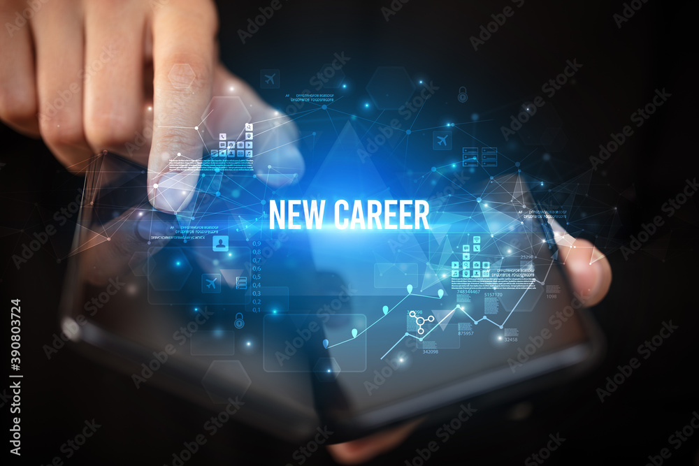 Businessman holding a foldable smartphone with NEW CAREER inscription, business concept Businessman holding a foldable smartphone with NEW CAREER inscription, business concept