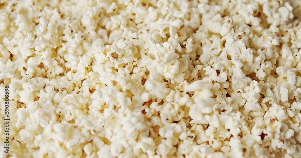 delicious popcorn on a rotating background delicious popcorn on a rotating background