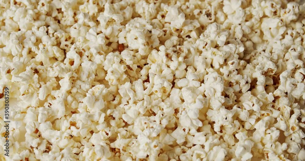 delicious popcorn on a rotating background delicious popcorn on a rotating background