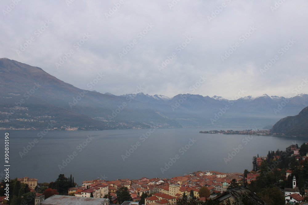 the alps over the lake como with the fog under them