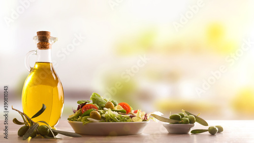 Fototapeta Naklejka Na Ścianę i Meble -  Mediterranean gastronomy with fresh vegetable salad and olive oil kitchen